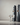 Picture of a dark modern living room with black surround sound speakers